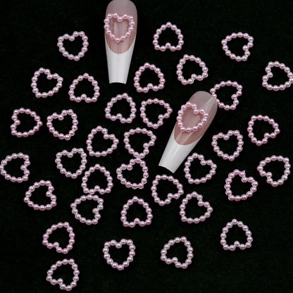 Aichashi 100pcs White Purple Pink Heart Pearl Nail Decoration Hollow Charms Bulk 3D Nail Art Accessories For Women Girl Nails